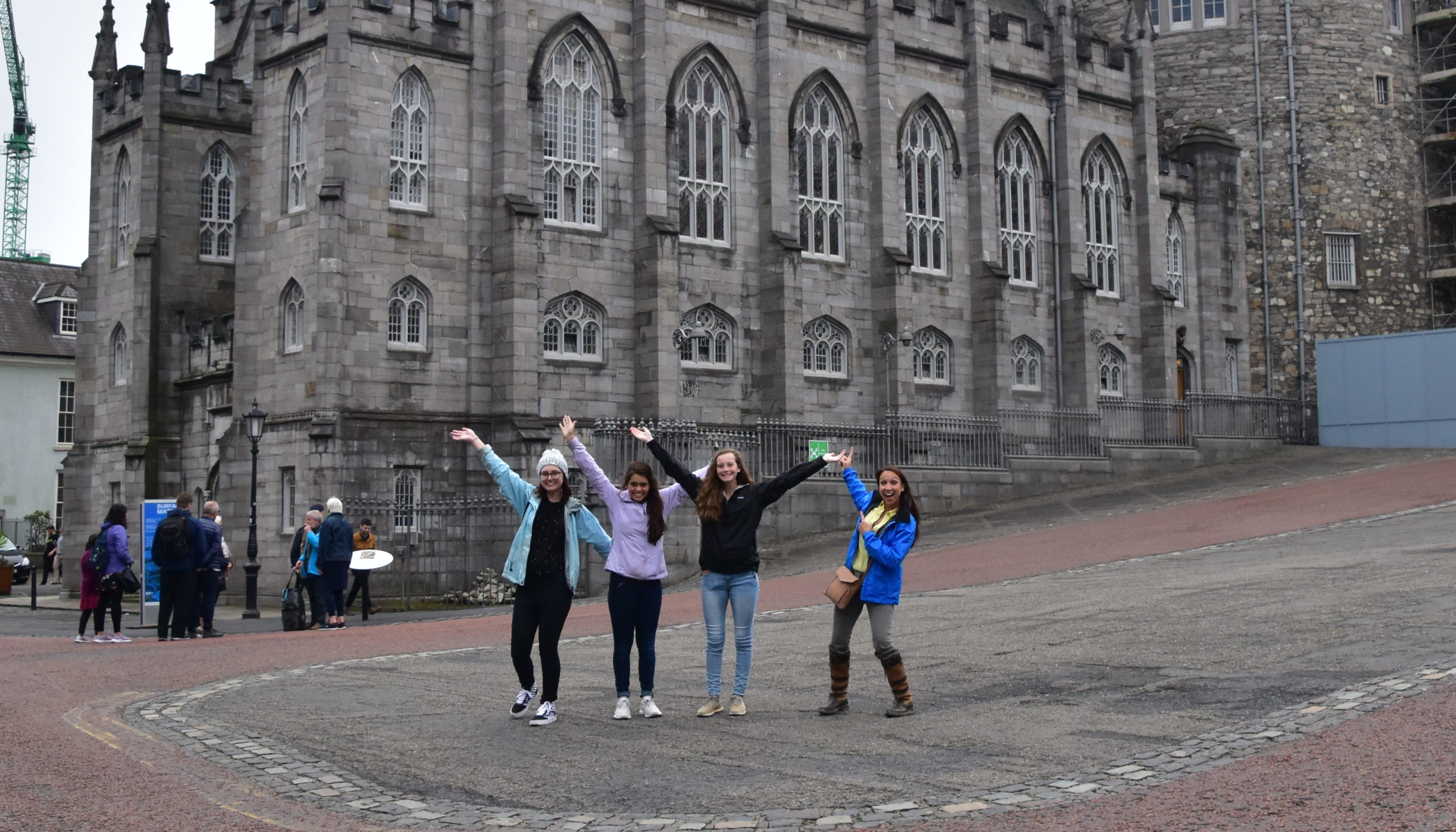 students posing in front of a building