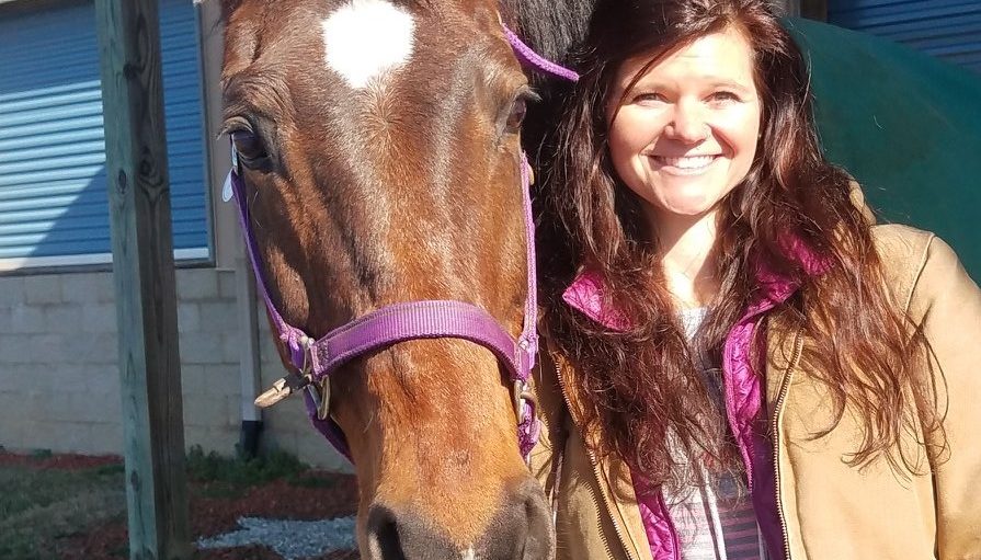 smiling girl with horse